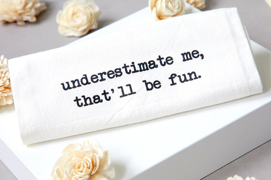 underestimate me- tea towel